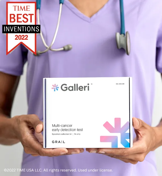 Person in purple top with stethoscope holding a Galleri box with a Time Best Inventions 2022 banner flag over the image.