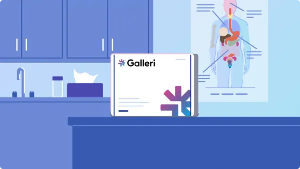 illustrated video poster of the Galleri test sitting on a table in an examination room with an anatomy poster on the wall behind it